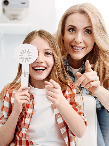 eye exam with mother and child